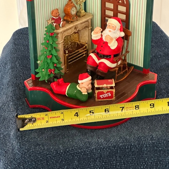 Cute Santa scene. Santa rocks and an elf looks at a box of toys. Missing cord. - Picture 8 of 12